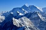 Everest in the distance with snow flag